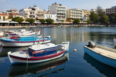 Agios Nikolaos, Greece, August 17, 2013: Many beautiful multi-colored pleasure boats anchoring in the bay waiting for tourists