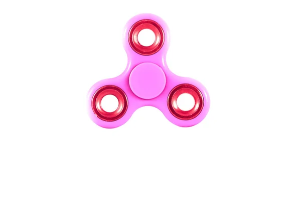 Rosa Fidget Spinner in weiß isoliert Hintergrund für Stressabbau während der Arbeit — Stockfoto