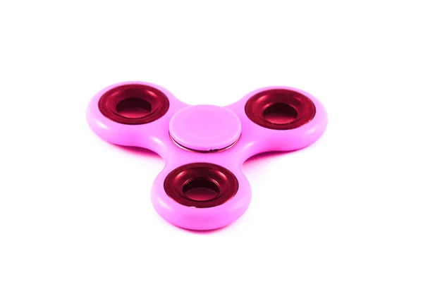 Pink Fidget Спиннер в белом изолированном фоне для снятия стресса во время работы — стоковое фото