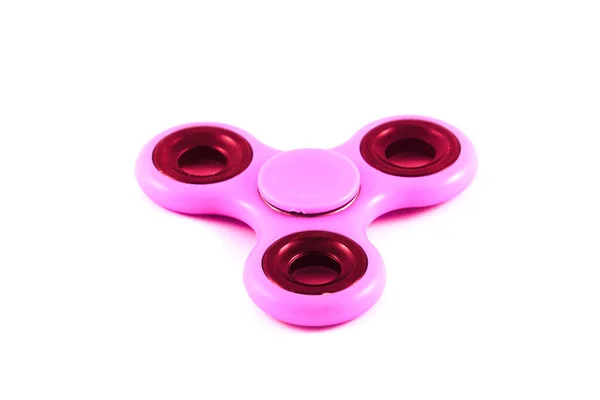 Pink Fidget Спиннер в белом изолированном фоне для снятия стресса во время работы — стоковое фото