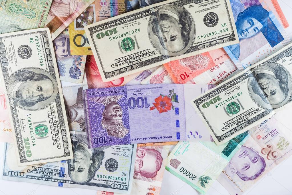 Multiple Currencies banknotes as colorful background showed the global money financial business economy crisis
