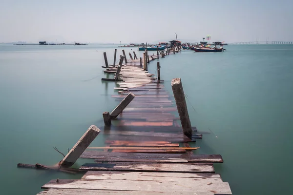 Water overflow on a broken wooden bridge