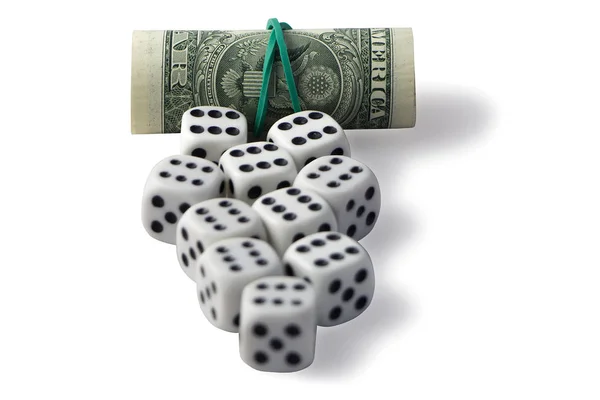 Dobbelstenen en roll geld met schaduw op een witte achtergrond. — Stockfoto