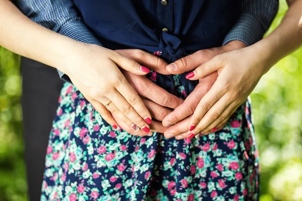 Young couple holding hands — Stock Photo, Image