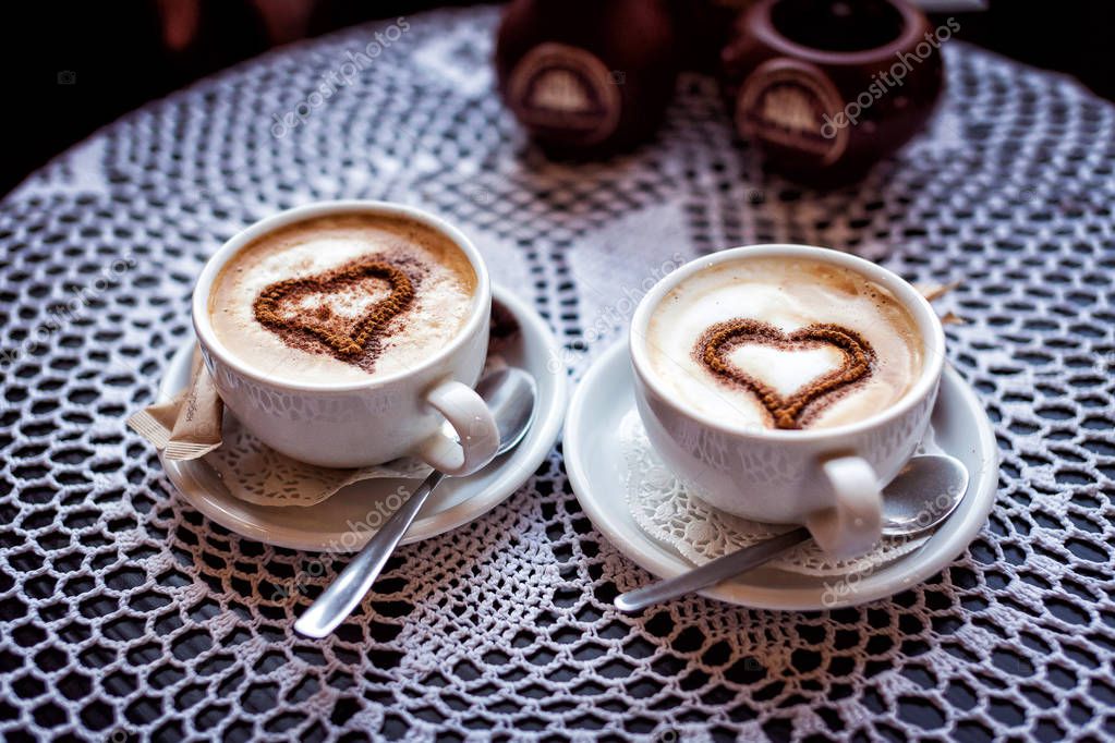 Coffee breaks, two cups of coffee on a table, couple, dessert, romance