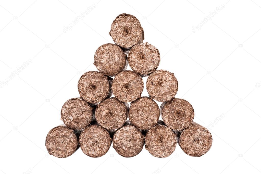briquette. wood briquettes. briquettes isolated on white background. firewood. biofuels. fuel. a natural source of energy
