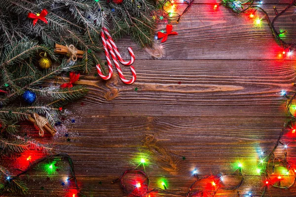 Christmas wooden background with snow fir tree. View with copy space.Christmas tree branch with decorations on wood background. Xmas holiday concept. Christmas gifts, copy space — Stock Photo, Image