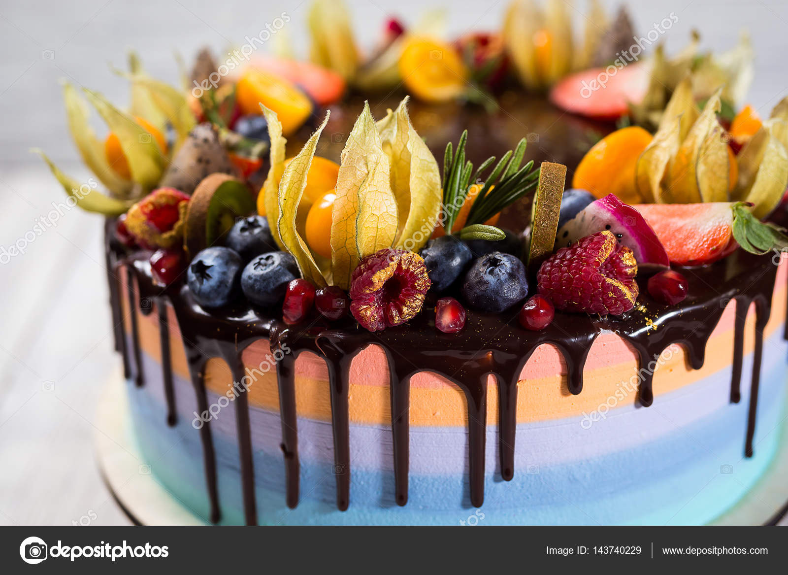 Chocolate Cupcakes With Colored Layers Decorated With Fruit