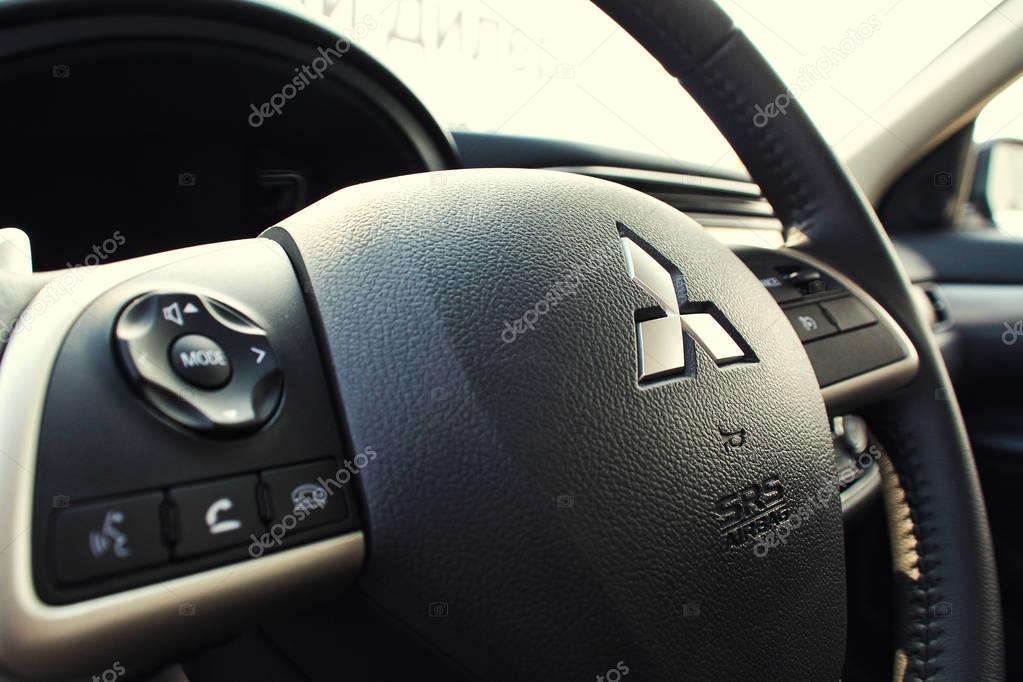 Vinnitsa, Ukraine - September 15, 2012. Mitsubishi concept car.Inside the car,steering wheel,interior of the car, logo Mitsubishi,showroom.Presentation of the new model Mitsubishi car
