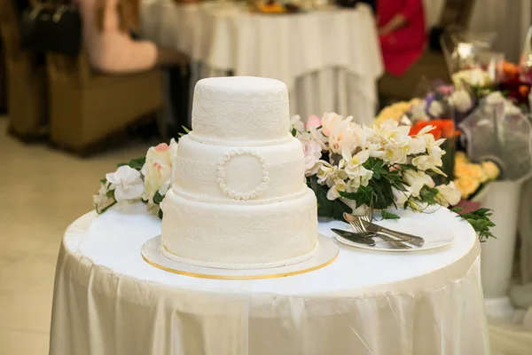 wedding cake, festive multi-storey cake, a cake in white tone, E