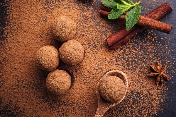 Chocolate truffle,Truffle chocolate candies with cocoa powder.Homemade fresh energy balls with chocolate.Gourmet assorted truffles made by chocolatier.Chunks of chocolate and coffee beans,copy space