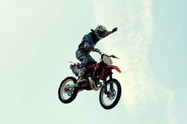 Kiev,Ukraine-28 of April,2012.Red Bull X-Fighters Exhibition Tour. Freestyle Motocross. Sportsman carries out a trick,bikers make a jump at the trial show — Stock Photo, Image