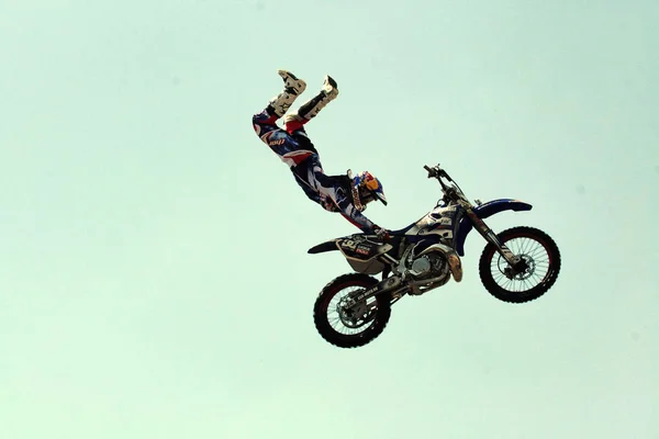 Kiev,Ukraine-28 of April,2012.Red Bull X-Fighters Exhibition Tour. Freestyle Motocross. Sportsman carries out a trick,bikers make a jump at the trial show — Stock Photo, Image