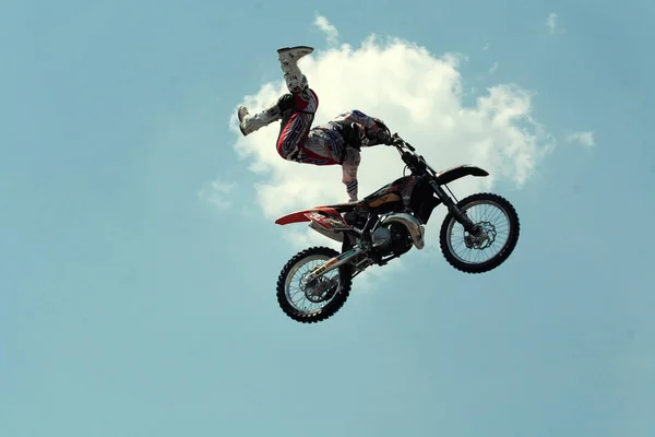 Kiev,Ukraine-28 of April,2012.Red Bull X-Fighters Exhibition Tour. Freestyle Motocross. Sportsman carries out a trick,bikers make a jump at the trial show — Stock Photo, Image