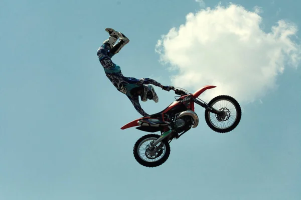 Kiev,Ukraine-28 of April,2012.Red Bull X-Fighters Exhibition Tour. Freestyle Motocross. Sportsman carries out a trick,bikers make a jump at the trial show — Stock Photo, Image