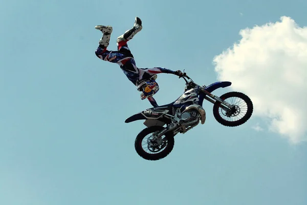 Kiev,Ukraine-28 of April,2012.Red Bull X-Fighters Exhibition Tour. Freestyle Motocross. Sportsman carries out a trick,bikers make a jump at the trial show — Stock Photo, Image