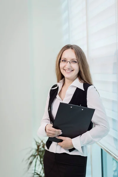 Modern business woman in the office with copy space,Business woman portrait,Successful business woman looking confident and smiling,business woman in glasses,copy space Royalty Free Stock Images