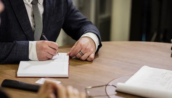 Close up businessman signing documents.Businessman is signing a contract,Man signing a document or writing correspondence