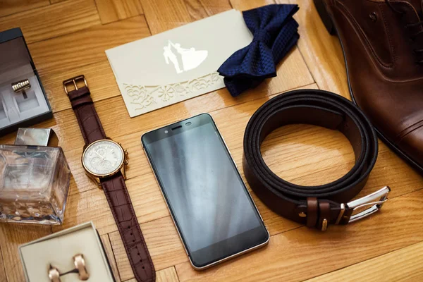 stock image bow tie,shoes,belt, wedding rings in box,telephone,clock,parfumes,cufflinks,Invitation card,the groom morning,businessman, wedding, man fashion, men's Accessories