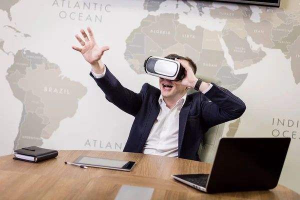 Man wearing virtual reality goggles,Businessman making gestures when wearing virtual reality goggles,virtual reality goggles concept,Smartphone using with VR headset,Future technology concept