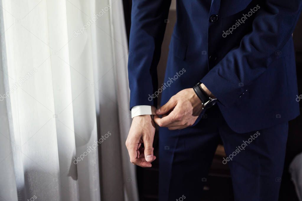 Businessman wears a jacket.Politician, man's style,male hands closeup, American, European businessman, business, fashion and clothing concept