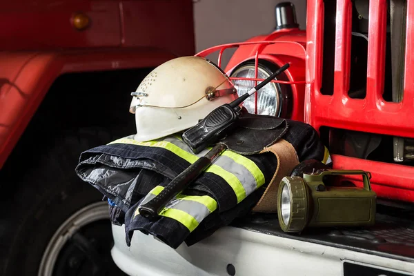 Firemen gear on firetruck such as, special clothing, ration,lamp, helmet and hydrant — Stock Photo, Image