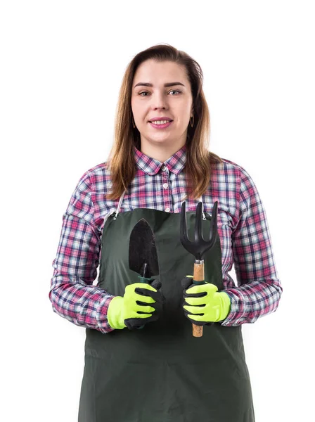 Vrouw professionele tuinman of bloemist in schort holding tuingereedschap geïsoleerd op witte achtergrond — Stockfoto