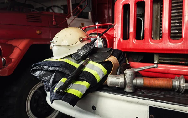 Firemen gear on firetruck such as fire barrel, special clothing,