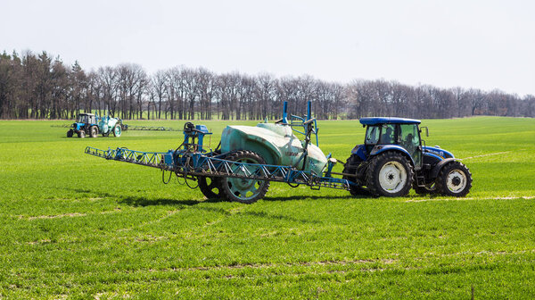 11 of April,2018 - Vinnitsa, Ukraine. Tractor spraying insectici