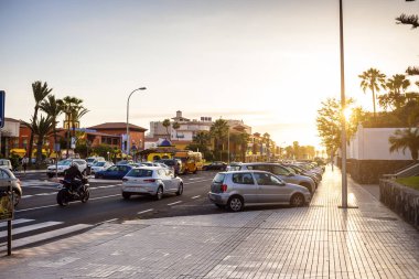 Playa de Las Americas,Tenerife,Canary Islands,Spain - May 11,2018: Seafront promenade with palm trees in Las Americas - one of the most popular resorts in Tenerife.