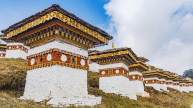 Dochula pass 108 chortens (Asian stupas) clipart
