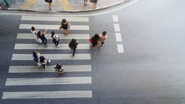 people walk and watch on crosswalk street at the top view of cit clipart