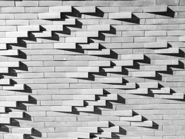 beton tuğla arka plan ışığı ile duvar ve tuğla cephe dış binadan kalıptan çekilmiş dalga hareketinin grup desende üzerinde gölge.