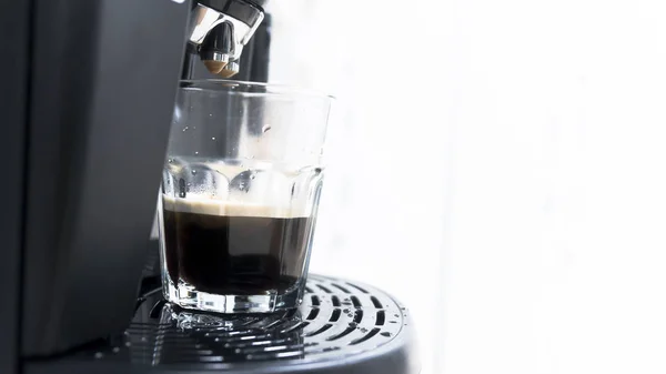 Cup of coffee with drop of water from bean to coffee machine in cappuccino and espresso style