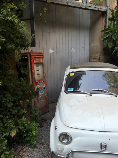 Vintage white Italian car parked