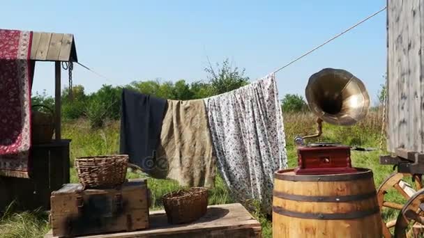 Rags drying on the clothesline in the village — Stock Video