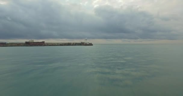 Aerial sea view and lighthouse over the clouds — Stock Video