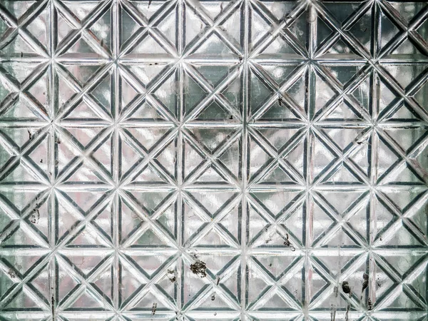 Üveg a négyzetek mintázata egy elhagyatott épület Stock Kép