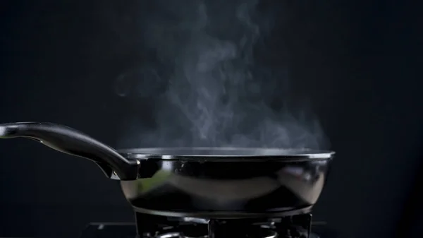 Frying pan steaming — Stock Photo, Image