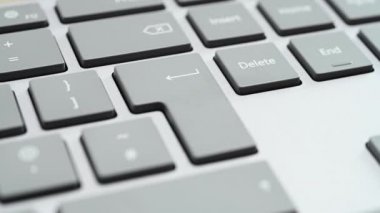 Finger pressing the enter key