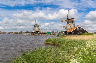 Traditional Dutch windmills at Zaanse Schans, Amsterdam clipart
