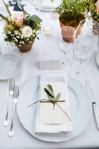 Table set for wedding or another catered event dinner. Italian villa