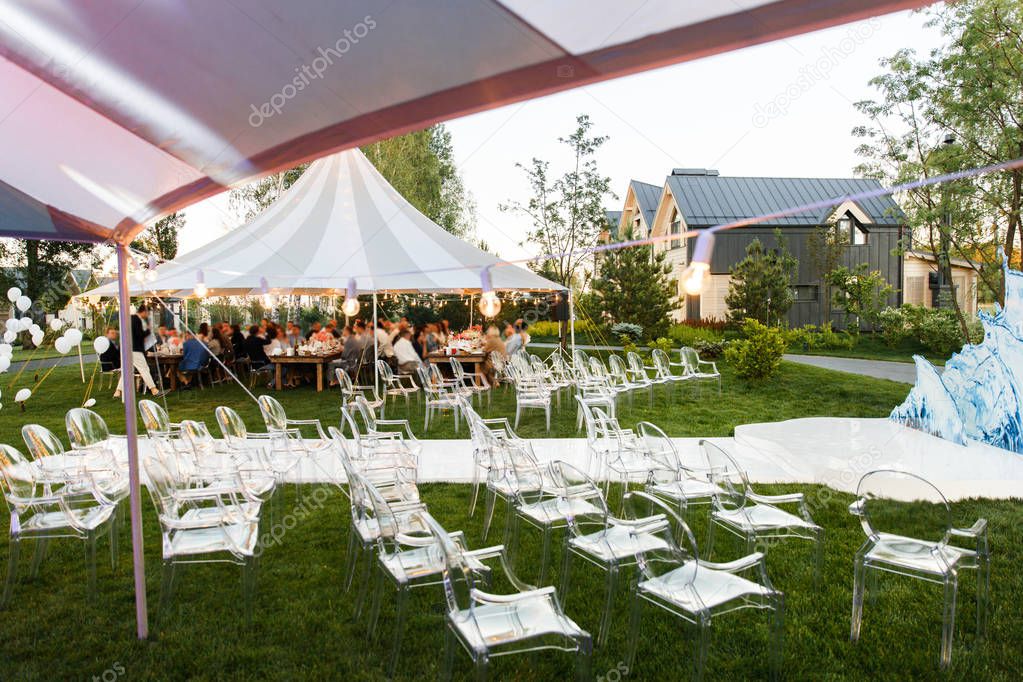 Outdoor wedding ceremony in the forest and wedding tents