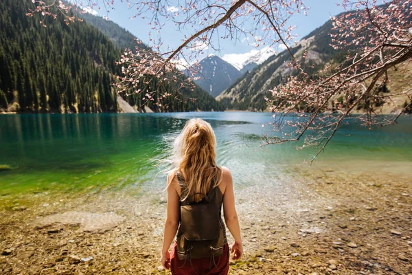 Young Blonde Woman Standing Branch Blossoming Tree Spring Shore Mountain — Stock Photo, Image