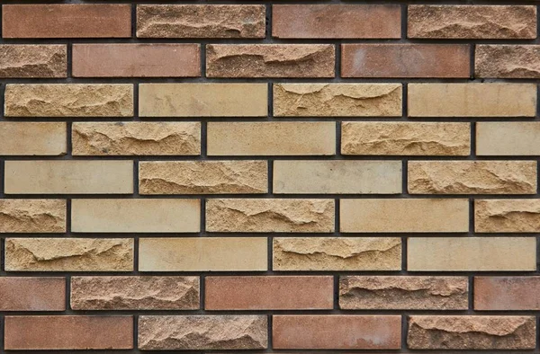 Brick wall of multi-colored bricks