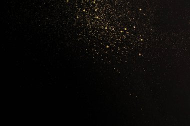 Siyah arka planda Noel altın parıltısı. Tatil özeti