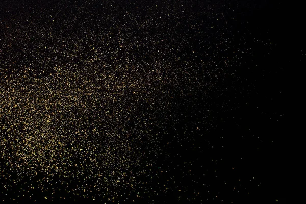 Brilho de ouro de Natal no fundo preto. Férias textura abstrata — Fotografia de Stock