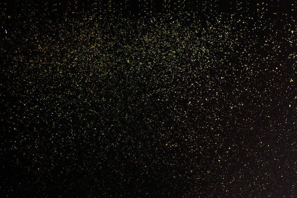 Brilho de ouro de Natal no fundo preto. Férias textura abstrata — Fotografia de Stock