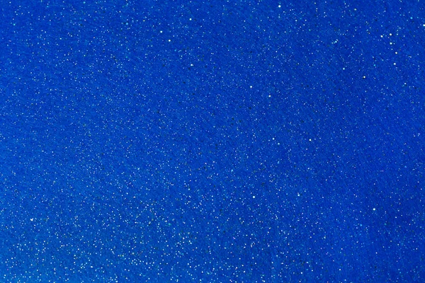 Shiny bright blue sky brilliant paper glitter background. Christmas abstract background. Element of design.