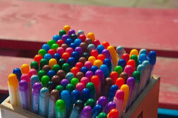 Close-Up color pencils and markers in metal glass on wooden background . Box for pens and pencils . Colored pencils in a pencil case. — Stock Photo, Image